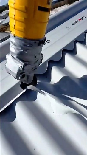 Electric Nibbler Cutting Through Corrugated Metal Sheet with Smooth Precision