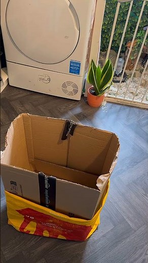 Turn Amazon boxes into practical kitchen bins with this recycle hack.