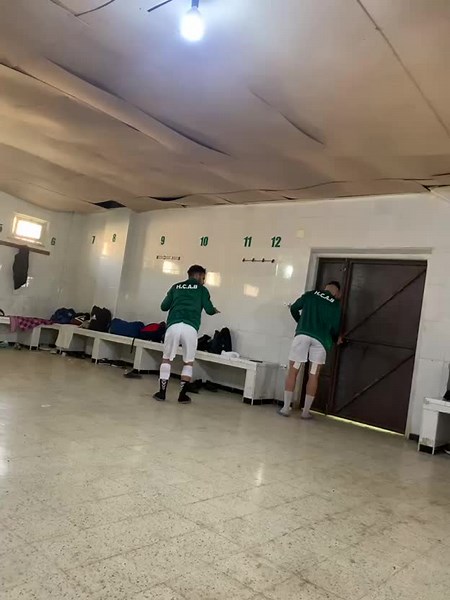 Soccer Players Celebrate in Locker Room