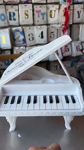 🎹This is a Miniature Grand Piano Toy for children. Design: Modeled after a white baby grand piano. Keys & Features: It is an electronic keyboard, typically featuring 24 keys, various musical effects, built-in songs, and sometimes a microphone. Benefit: Promotes early musical interest, auditory memory, and brain stimulation. | Libsun- লিবসুন