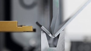 During air bending, the upper tool presses the workpiece into the bottom tool opening, however without bottoming. The workpiece rests solely on the two edges of the bottom tool during the entire bending process. The bending angle is determined by how deep the top tool plunges into the bottom tool. Air bending permits bending at various angles without a tool change. This process uses less tonnage than other bending processes. This means your machine and tooling last longer due to less impact. | B