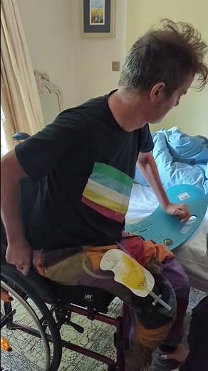 'Banana board' for easier bed to Wheelchair transfer.