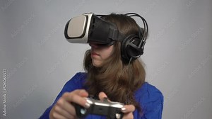 4k Young woman wearing VR glasses and interacting with virtual reality