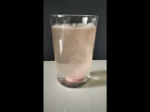 Slow motion video of Effervescent Tablet Dissolving in Water and forming of bubbles