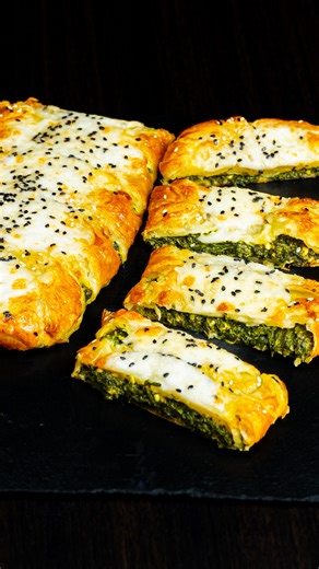 The famous puff pastry appetizer that's taking the world by storm Ingredients puff pastry: 275 g (9.7 oz) frozen spinach: 400 g (14 oz) feta cheese: 140 g (4.9 oz) mozzarella: 100 g (3.5 oz) garlic: 20 g (0.7 oz) salt: 1 g (0.0 oz) black pepper: 1 g (0.0 oz) eggs: 1 pc mozzarella balls: 120 g (4.2 oz) black sesame seeds: 8 g (0.3 oz) white sesame seeds: 8 g (0.3 oz) | Appetizing.tv