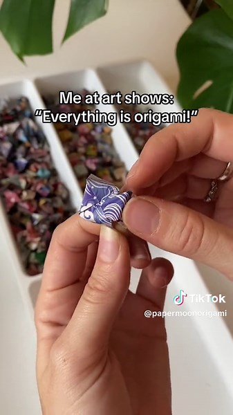 this is called modular origami, where you fold many pieces of paper and combine them at the end! When you think of origami, you probably think of one piece of paper folded over and over again into some crazy final form - this kind of origami can be magnificent but very complicated to fold. I prefer modular origami because it is repetitive and relaxing, and folding 24 base units to make a pair of earrings is not so bad when you can binge X-Files in the background! At the end, assembling all of th