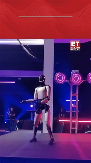 2.1K views · 6K reactions | Tesla’s Optimus robot stole the spotlight after Elon Musk secured his 2025 CEO performance award, celebrating the historic $1 trillion pay package approval. The robot’s dance performance symbolised Tesla’s focus on advanced robotics, AI, and automation. [Tesla, Optimus robot, Elon Musk] #ETTrendingNow | ET NOW | Facebook