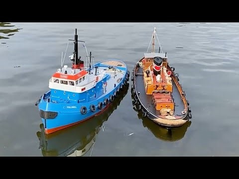 Tugs and sailboats on a flat calm morning