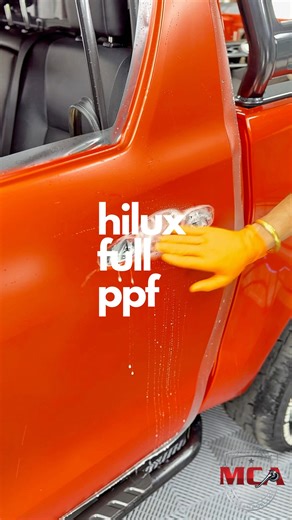 🔸 Toyota Hilux – Built Tough, Wrapped Stealth 🔸 The Hilux is already an icon, but this one just leveled up. We took this bold Orange finish and gave it a complete stealth transformation at Mr. Clean. ✅ Full Body Satin PPF This isn’t just protection; it’s a total restyle. We transformed the factory gloss into a sleek, frosted satin finish. It looks aggressive and provides heavy-duty armour against bush pinstripes, stone chips, and off-road debris. ✅ Nano Ceramic Window Tint Essential heat rejec