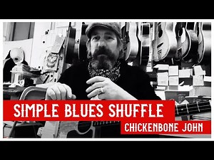 Learning the basics of a simple blues shuffle on Cigar Box Guitar, with Chickenbone John