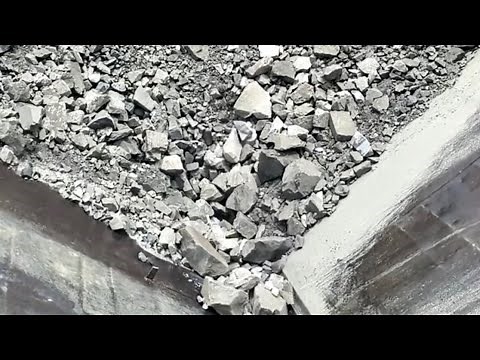 Barge unloading iron ore and river rock - relaxing video, relaxing sound flow