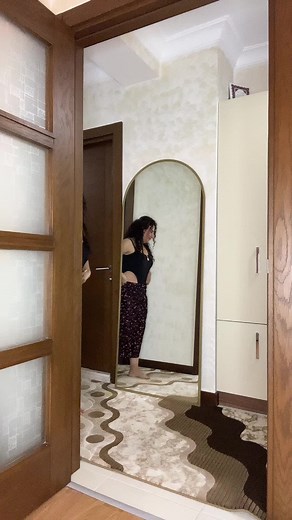 Stylish Mirror Pose: Woman in Floral Skirt