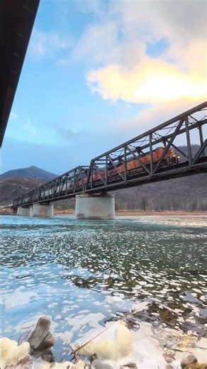 Check out this BNSF Grain Train going over a River in Montana