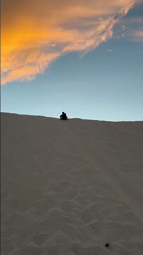 Sledding on Sand Dunes at White Sands National Park in New Mexico