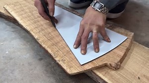 Leaf-Inspired Table Design with Soft Curved Wood Veins