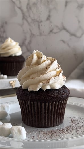 Hot Cocoa Cupcakes with Marshmallow Buttercream Cupcakes 1 box Betty Crocker™ Super Moist™ Chocolate Fudge Cake Mix 1/2 cup hot cocoa mix 1/2 cup whole milk 1/2 cup full-fat sour cream 1/2 cup vegetable oil 3 large eggs 1 teaspoon vanilla Ganache 1 cup semisweet chocolate chips 2 tablespoons hot cocoa mix 1/2 cup heavy whipping cream Frosting 1 cup unsalted butter, softened 1 jar (7 oz) marshmallow creme 3 cups powdered sugar 1 tablespoon heavy whipping cream 1 teaspoon vanilla 1/4 teaspoon salt