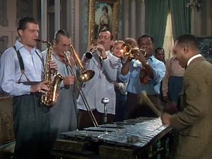 "A Song Is Born" 1948 Louie Bellson, Benny Goodman, Lionel Hampton, Dorsey, Armstrong A Song Is Born (also known as That's Life) is a 1948 Technicolor musical film remake of the 1941 movie Ball of Fire with Gary Cooper and Barbara Stanwyck, starring Danny Kaye and Virginia Mayo. It was directed by Howard Hawks. Based on the Story "From A to Z" by Billy Wilder and Thomas Monroe. Produced by Samuel Goldwyn and released by RKO Radio Pictures. Filmed in Technicolor, it featured a stellar supporting 
