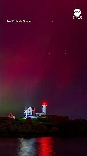 Timelapse footage captures aurora borealis dancing above Maine lighthouse