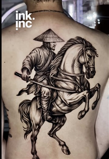 Full back tattoo featuring a samurai warrior on horseback—high-detail black and grey realism, dynamic shading, and bold linework. This piece highlights traditional Japanese tattoo elements, warrior art, and large-scale back tattoos designed for maximum impact. Perfect inspiration for anyone looking for realism tattoos, samurai tattoos, or epic full-back designs. #TattooArt #SamuraiTattoo #BackTattoo #RealismTattoo #InkMaster