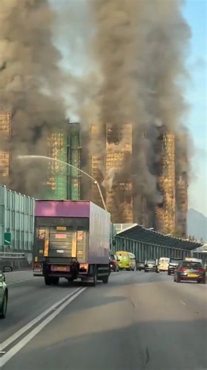 A massive fire engulfed multiple high-rise towers in a Hong Kong residential complex Wednesday, killing at least 13 people including a firefighter and injuring more than 10 others. The blaze, which started around 2:45 p.m. local time, spread rapidly across seven of the eight blocks at Wang Fuk Court in the northern Tai Po district, trapping an unknown number of residents. Strong winds fanned the flames, accelerated by bamboo scaffolding on the buildings due to ongoing renovations. Bamboo, a comm