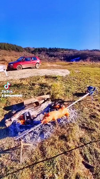 Rural Outdoor Pig Roast by Small Brick House