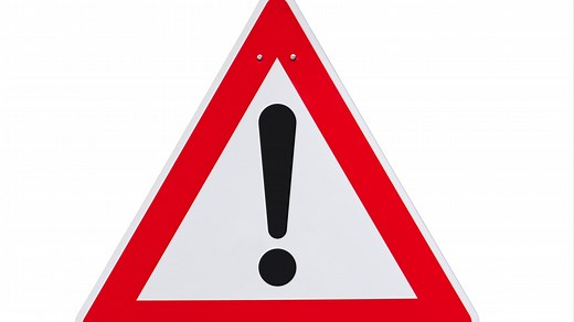 What does a red triangle road sign with an exclamation mark mean?