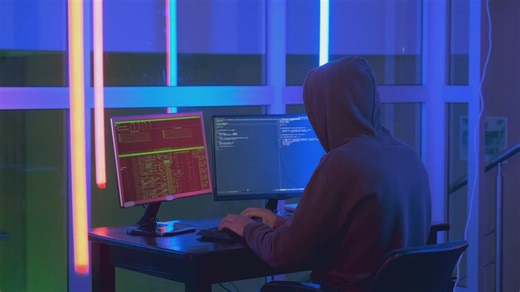 Hacker writing code on a computer screen - Free Stock Video