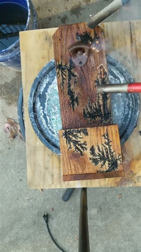 fractal burning a cedar bottle opener