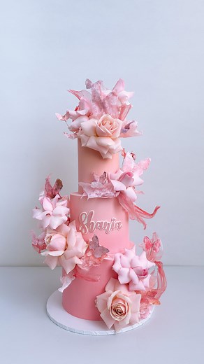 123K views · 128 reactions | I’ll never grow tired of this design. The blend of fresh roses, wafer paper, and rice paper, along with waffle paper butterflies, is just as charming as can be. And have you noticed the various shades of pink? I think the ombre color so boom , but hey love to let me your thoughts ☺️ | K CAKE | Facebook