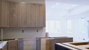 Installing new induction hob in modern kitchen Installation of kitchen cabinet. Stock Video