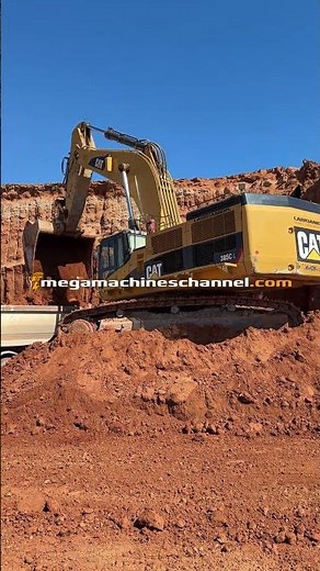 CAT Excavator In Action Digging Wall