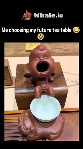 trend_tok_hub on Instagram: "The post showcases a viral video of a traditional Chinese Gongfu tea table featuring Yixing clay "tea pets," including a baby sculpture that drains excess water through its open mouth, creating a humorous illusion of the figure "drinking" tea. Shared by @bangetsih__ , a curator of internet curiosities, the clip humorously captions the user's indecision over adopting this quirky, functional setup for future tea sessions, amassing over 1 million views and 3,000 likes w
