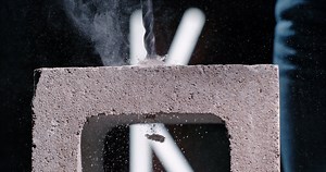 Did you know a hammer drill is also called a percussion drill? We shot ours at 1500 frames per second, so you won't miss a beat as it makes short work of a cinder block. | Kobalt Tools