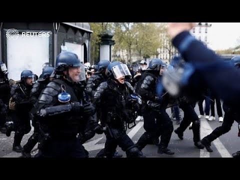 Riot police face off with protesters in Paris