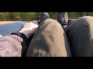 Deflating inflatable boat on the lake.