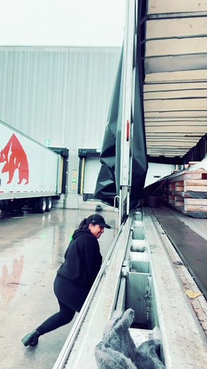 Warehouse Worker Unloading Goods from Truck