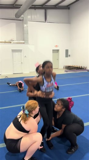 Level 1 Elite Cheerleading Team Practicing Stunts