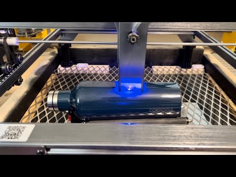Atomstack x7 Pro engraving a water bottle.