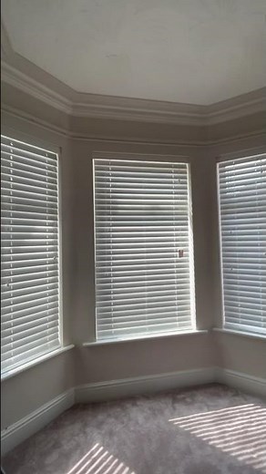 Large Slat Wooden Venetian Blinds on a walk in bay window