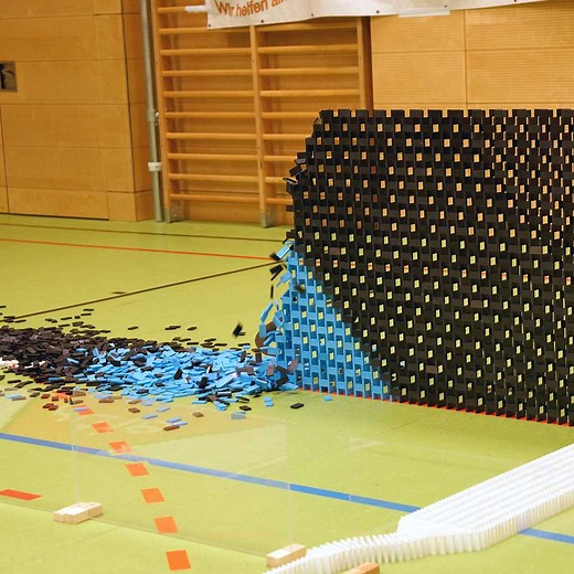9.7M views · 29K reactions | Throwback Thursday: This incredible 131.69 ft / 40.13 metre long domino wall was built using 42,173 dominoes, carefully constructed by members of Austria's Tulln Domino Team in 2016 | Guinness World Records | Facebook