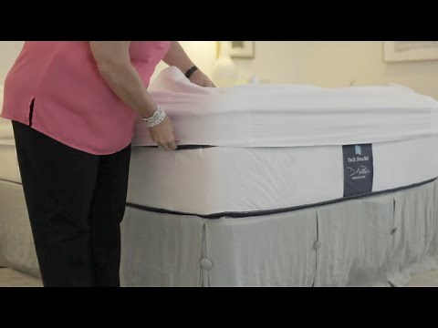 Putting the Better Bedder® on your mattress. No more tucking sheets under your heavy mattress!