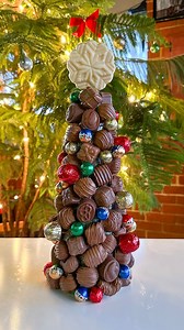 Put a sweet twist on the #CharcuterTree trend this holiday season! 🎄🍫✨ Grab a Deluxe Assortment and some Foiled Holiday Balls to assemble a centerpiece that’s sure to steal the spotlight at any festive gathering. Find the supplies you need at our Canonsburg store or find a Sarris Candies retailer in your neighborhood through the link in our bio. | Sarris Candies