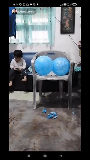 cute mother popping balloons