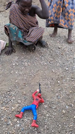Hadzabe grandmother is scared of the spiderman toy. #hadzabetribe #hadzabe #chaaba #dudukwe #viralvideos