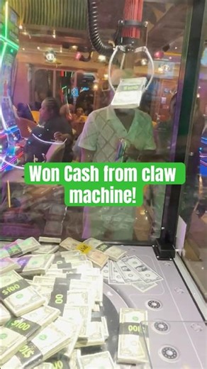 Winning CASH From A Claw Machine! ($700) #shorts #clawmachine #cash #cranegame #arcadegame #money