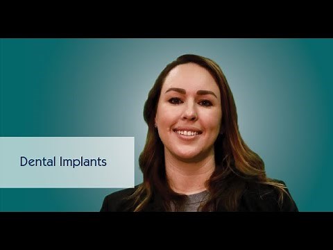 What are the components of a dental implant?