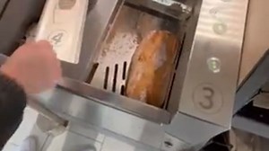 Satisfying process: Bread slicer turns a loaf into perfectly even slices