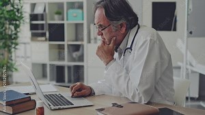 Doctor working with laptop computer