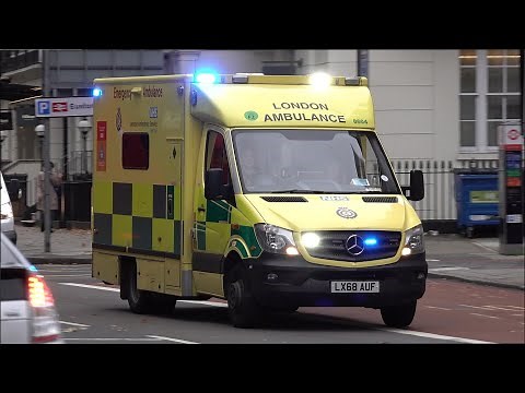 London Ambulance responding with siren and lights