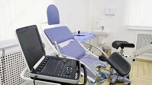 Interior of Gynecology Room in Medical Clinic. Gynecological Bed in Obstetrics and Gynecology Department of Hospital. Pregnancy Planning Concept